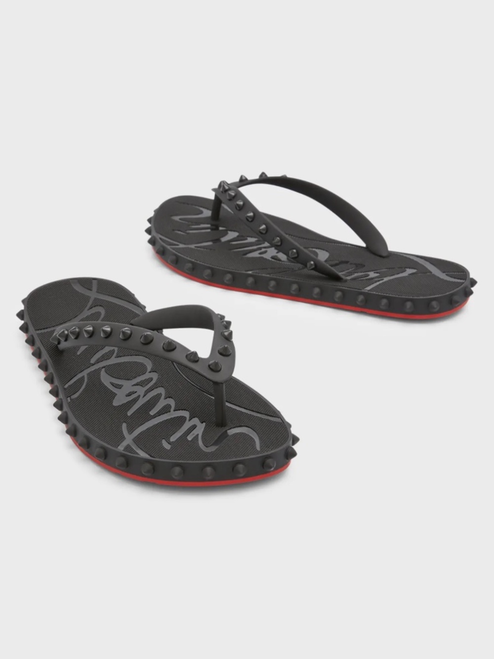 Christian Louboutin "Loubi" rubber studded flip flops.